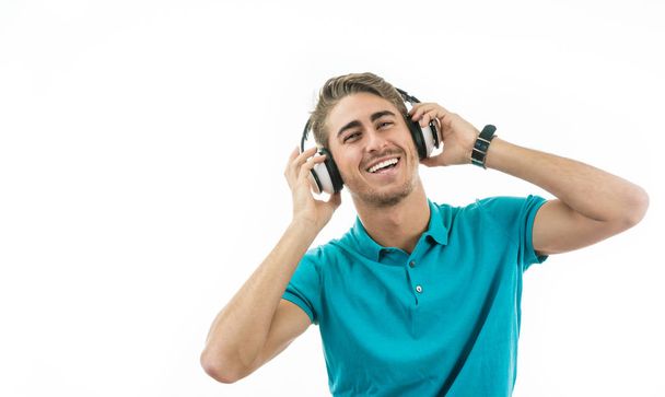 attractive man listening to music with headphones - Photo, Image