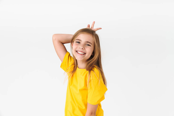 Portrait of cute blonde girl wearing casual t-shirt smiling and  - Foto, immagini