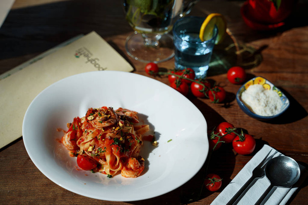 portion of italian pasta served on table - Foto, Imagen