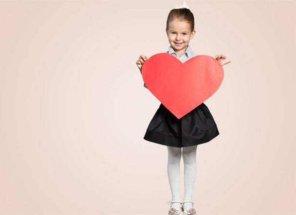 cute little girl with heart sign - Valokuva, kuva