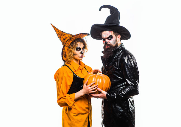 Halloween sale and shopping. Portrait of happy young couple in Halloween with pumpkin. - Photo, image