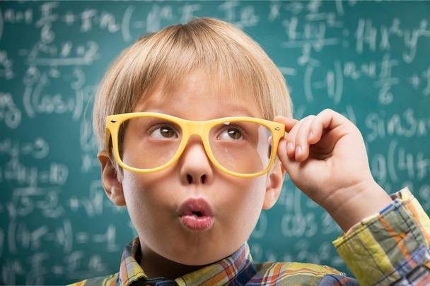 young boy in glasses thinking - Foto, imagen