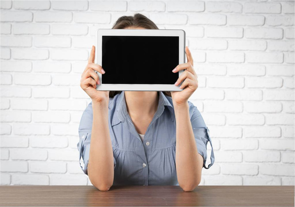 Woman holding digital tablet with blank screen  - Фото, зображення