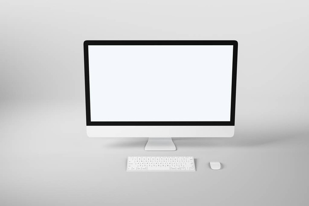 Blank white mock up modern computer monitor with white keyboard at abstract light background. - Фото, изображение