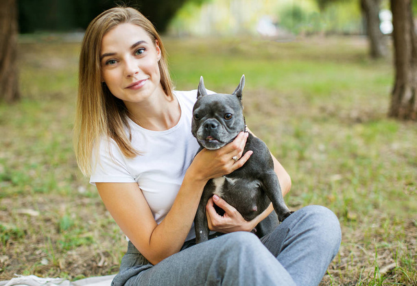 Portrait of a beautiful woman with dog. - Fotó, kép
