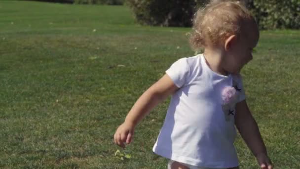 Cute little baby girl playing with a ball - Footage, Video