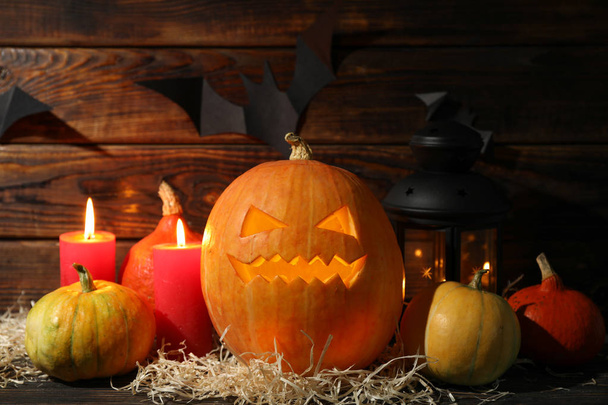 Halloween pumpkins and candles on dark wooden background, copy s - Photo, Image