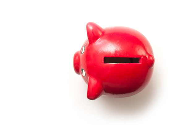 Closeup of red piggy bank on top view on white background - Fotografie, Obrázek