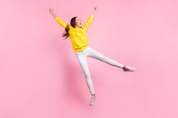 Full length body size photo of nice cute charming beautiful attractive rejoicing girlfriend flying away from here wearing yellow sweater footwear isolated with pastel color background - Φωτογραφία, εικόνα