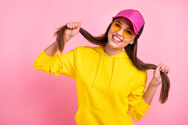 Photo of cute nice charming fascinating sweet lovely girlfriend holding her hands making tails wearing yellow sweater while isolated over pastel color background - Photo, Image