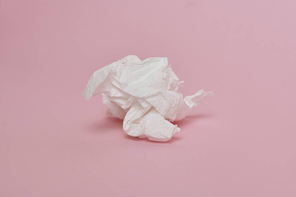 close-up view of used crumpled paper napkin on pink background  - Foto, afbeelding