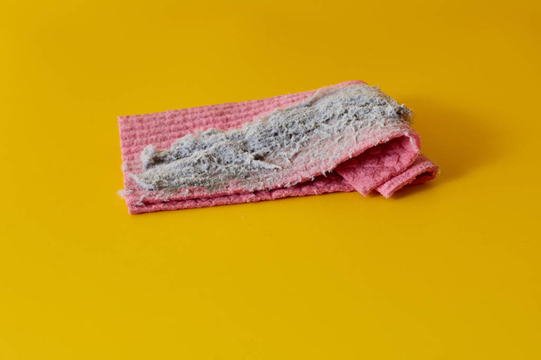 Rag with dust on yellow background - Foto, Imagem