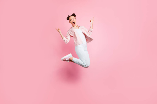 Full length body size view portrait of nice attractive charming lovely cute overjoyed cheerful cheery girl having fun rejoicing showing two horn sign isolated over pink pastel background - Фото, изображение
