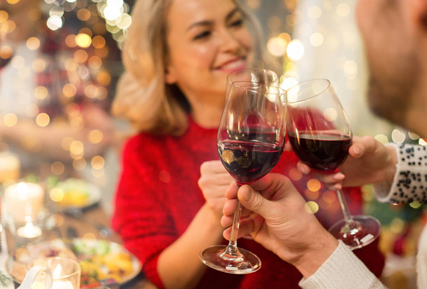 close up of friends with wine celebrate christmas - Photo, Image