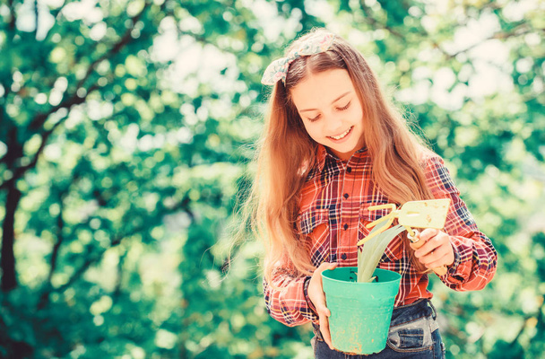 ecology environment. Happy childrens day. little girl with gardening tools. earth day. summer farm. Happy childhood. little girl kid in forest. spring village country. Enjoying her work - Photo, image