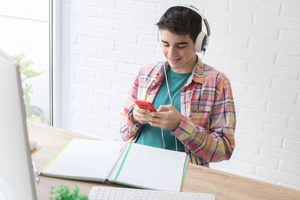 student with computer phone and headphones - Photo, Image