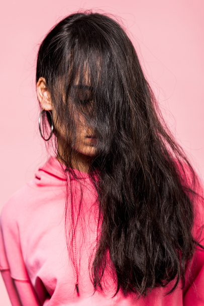 attractive asian woman in pink pullover with closed eyes isolated on pink  - Fotografie, Obrázek