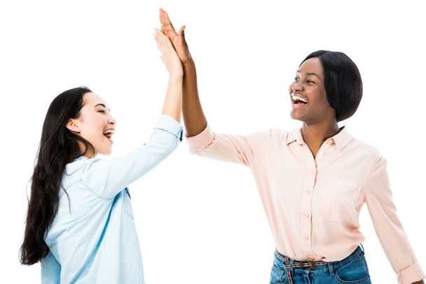 smiling asian and african american friends giving high five isolated on white  - Photo, image