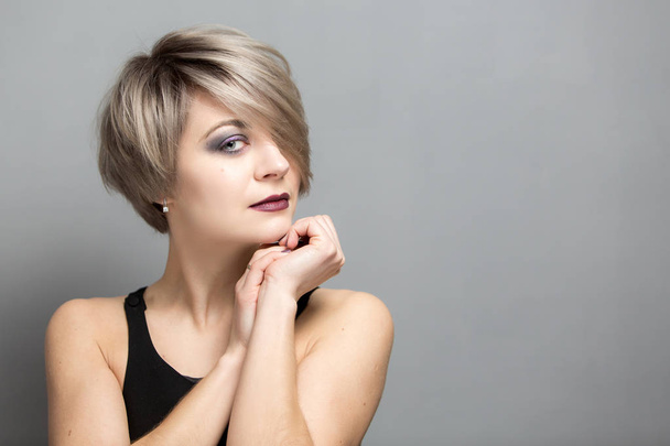Portrait of young beautiful blonde woman with short hair - Photo, Image