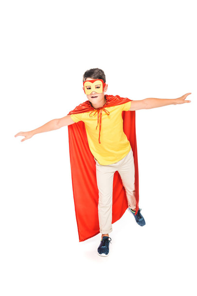 full length view of kid in mask and hero cloak isolated on white - Φωτογραφία, εικόνα