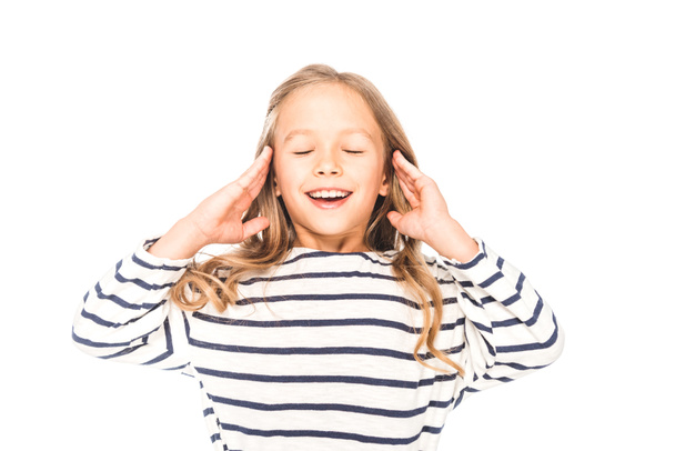 front view of cheerful kid smiling with closed eyes isolated on white - Foto, Bild