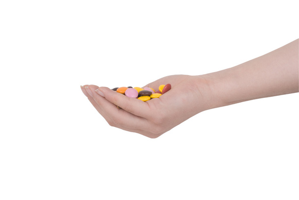 Рука с конфеты изолированы
 - Фото, изображение