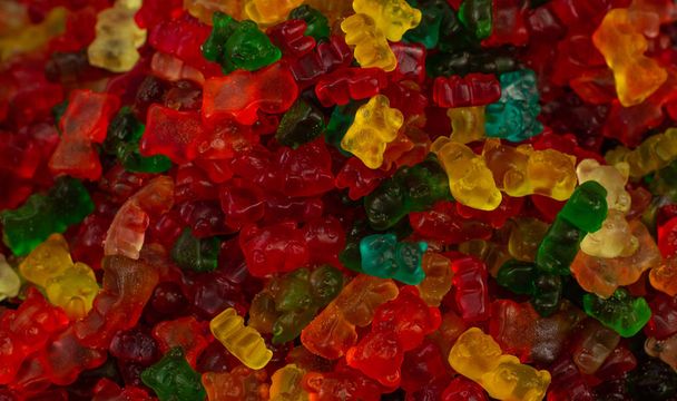egészségtelen élelmiszer lekvár viseli színes cukorka textúrázott háttér  - Fotó, kép