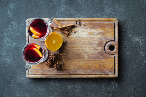 Christmas mulled red wine with spices on dark background - Φωτογραφία, εικόνα