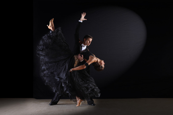 dancers in ballroom against black background - Valokuva, kuva