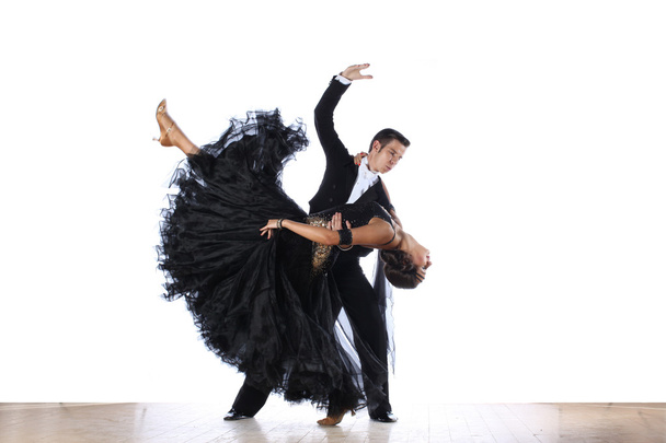 dancers in ballroom against black background - Valokuva, kuva