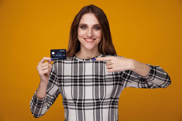 Exited girl with credit card isolated. Online shopping concept. - Fotografie, Obrázek