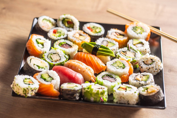 Assortment of japanese sushi rolls nigiri sashimi and maki - Photo, Image