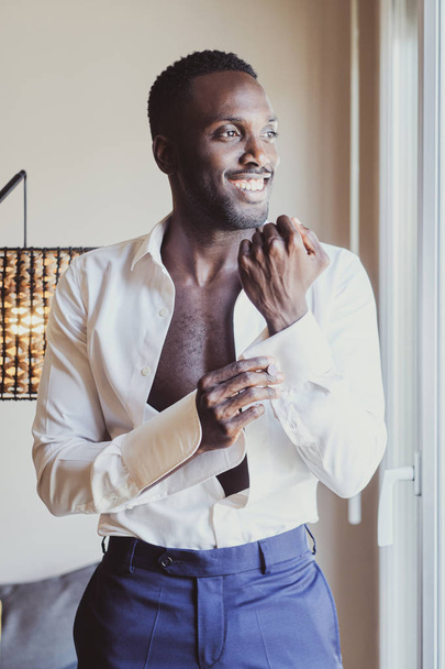 Elegant man is dressing up his cufflinks - Фото, изображение