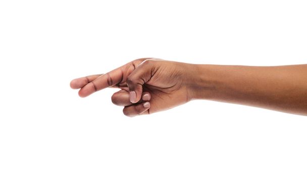 Fekete Womans kéz keresztbe ujjak, elszigetelt fehér háttér - Fotó, kép