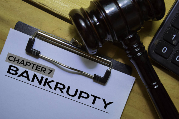 Bankcrupty Chapter 7 text on Document form and Gavel isolated on office desk. - Foto, imagen