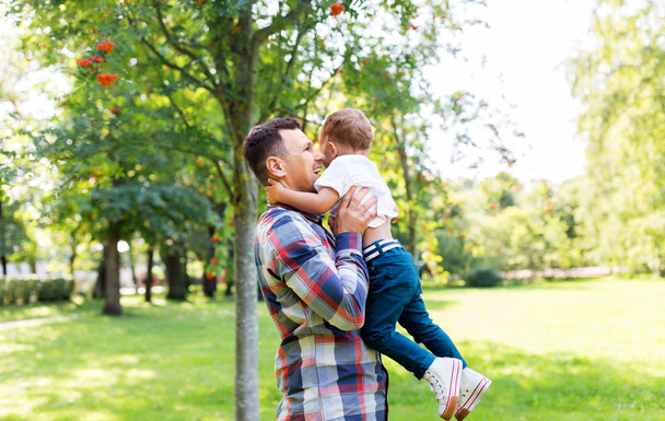 happy father with little son in summer park - Photo, image