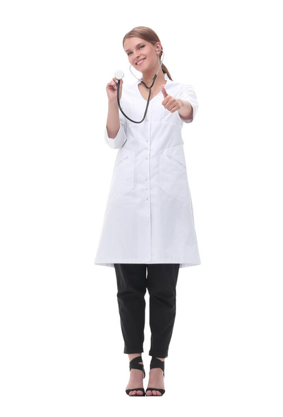 smiling woman doctor showing her stethoscope. isolated on white - 写真・画像