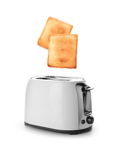 Modern toaster with tasty bread on white background - Photo, Image