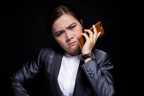 Woman calling the smartphone and she feel angry - Fotó, kép