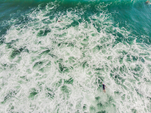 A view from above of the surfers in the ocean - Φωτογραφία, εικόνα