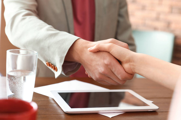 Business partners shaking hands after meeting, closeup - Fotoğraf, Görsel