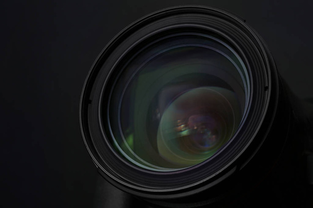 Lens of professional camera on black background, closeup - Фото, зображення