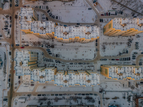 Top view of modern residential houses covered with snow - Photo, image