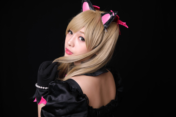 Japan anime cosplay , portrait of girl cosplay isolated in black background - Photo, Image