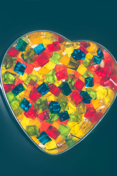 Jelly cake in the form of a heart with multi-colored cubes in th - Photo, Image