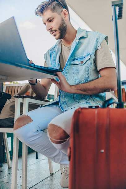 Passenger entrepreneur working on computer, businessman reading emails and smiling - 写真・画像