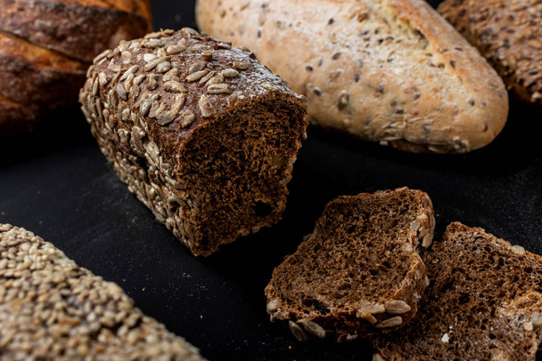 Bread on a black background. Close-up. - Photo, image