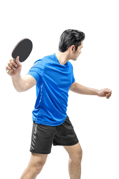 Asian table tennis player swings the racket posing  - Photo, image