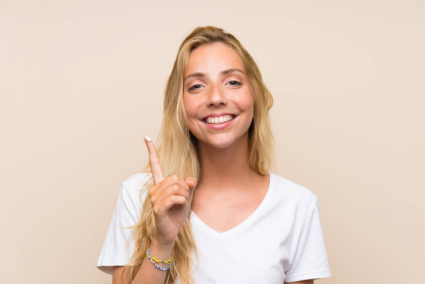 Happy Young blonde woman with moisturizer - Photo, Image