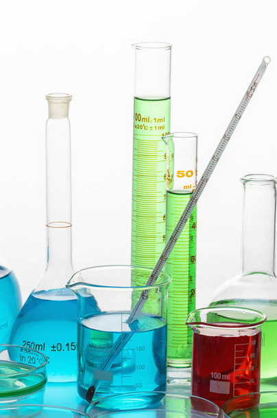 flasks with bright liquids in chemical laboratory - Foto, afbeelding